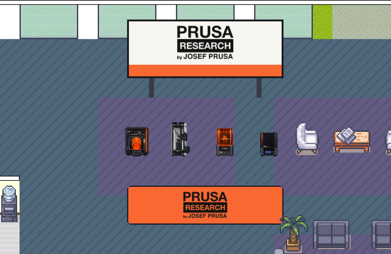 Стенд Prusa Research: банер на стіні, лінійка принтерів у ряд і другий банер на підлозі